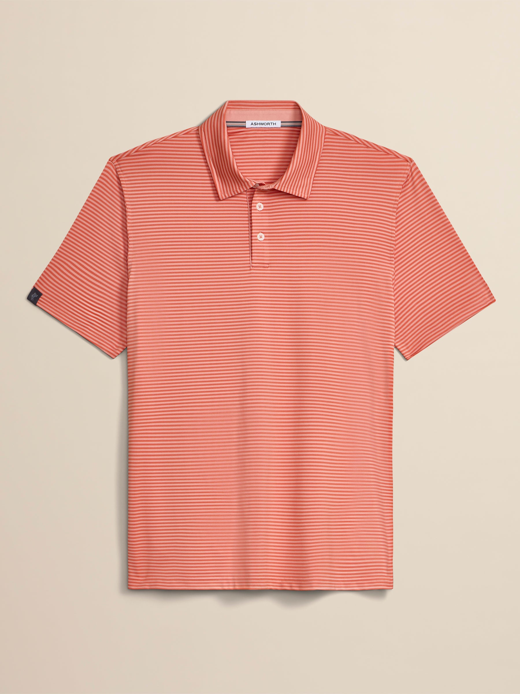 Red striped polo shirt on a beige background