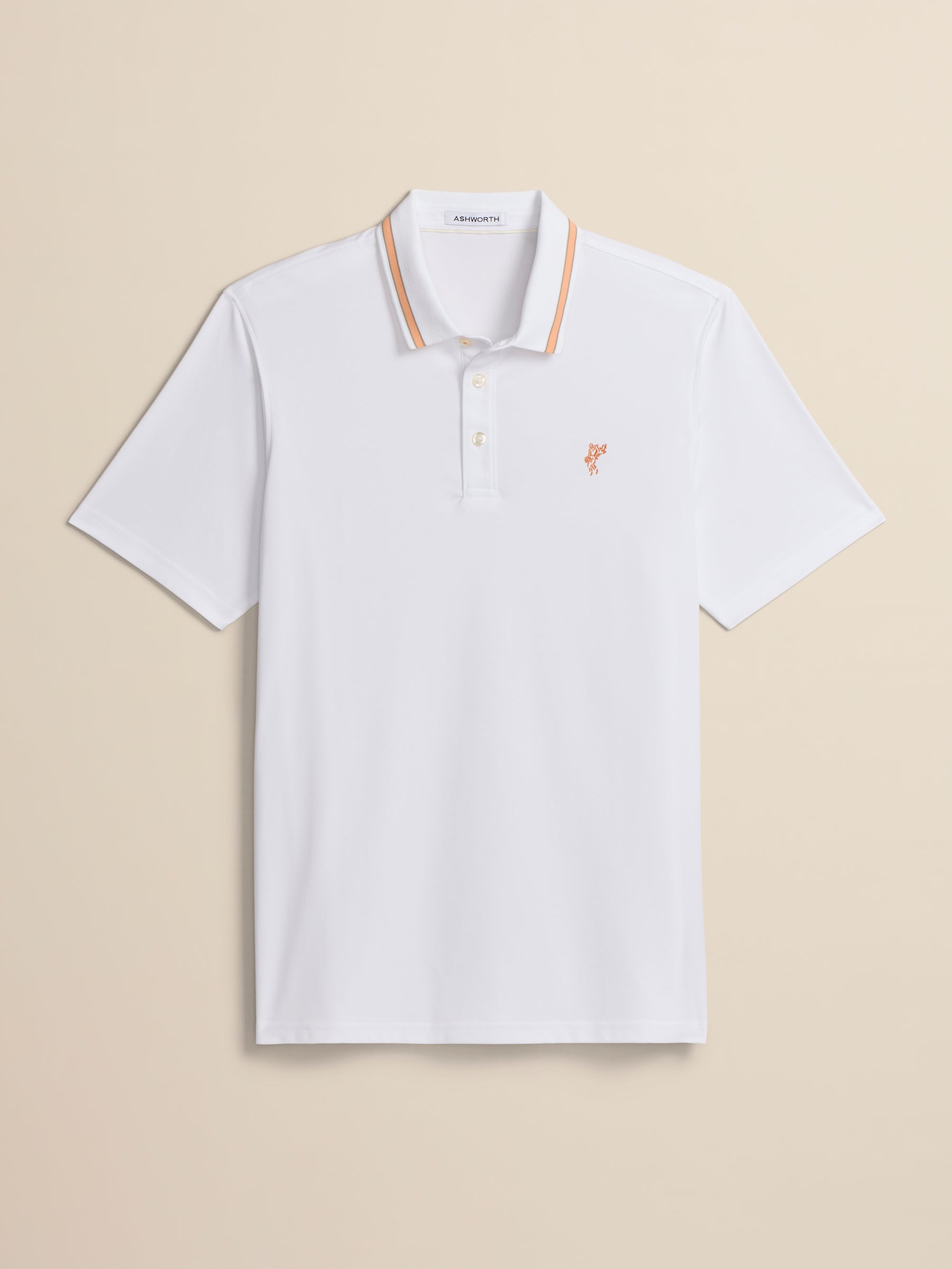 White polo shirt with a small logo on a beige background