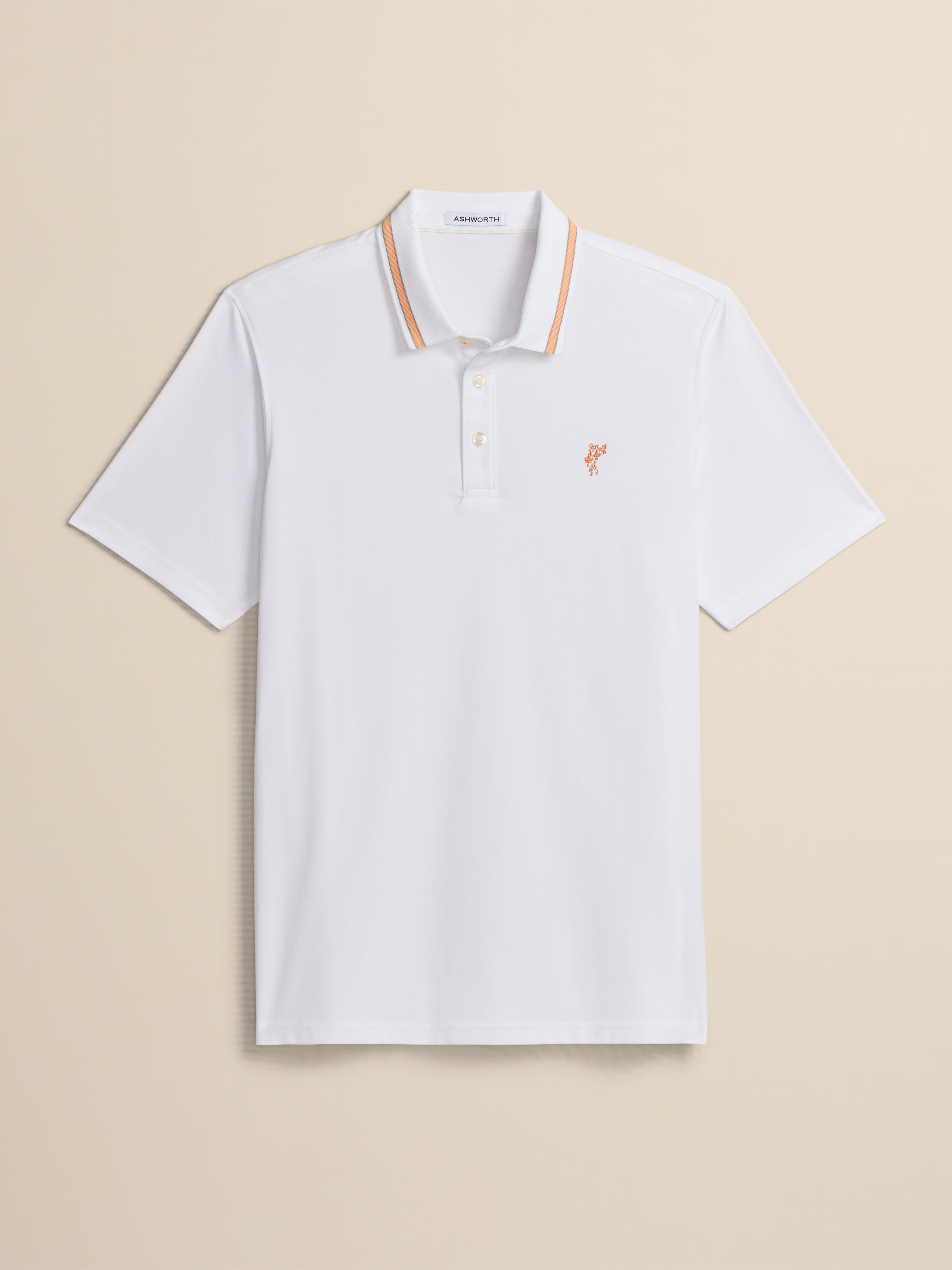 White polo shirt with a small logo on a beige background